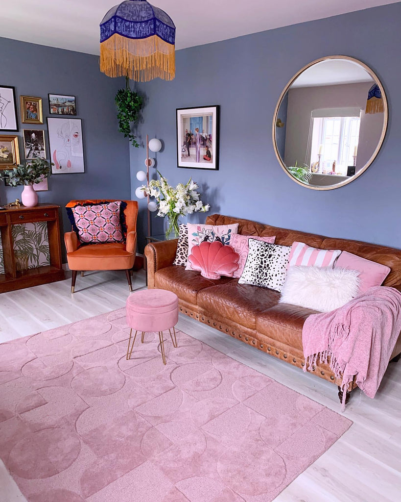 How should a rug look under couch?