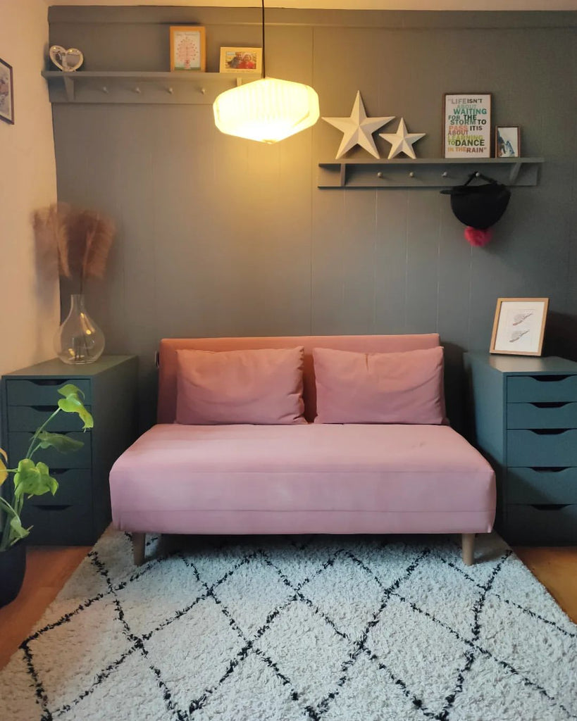 Should rugs go under sofas?