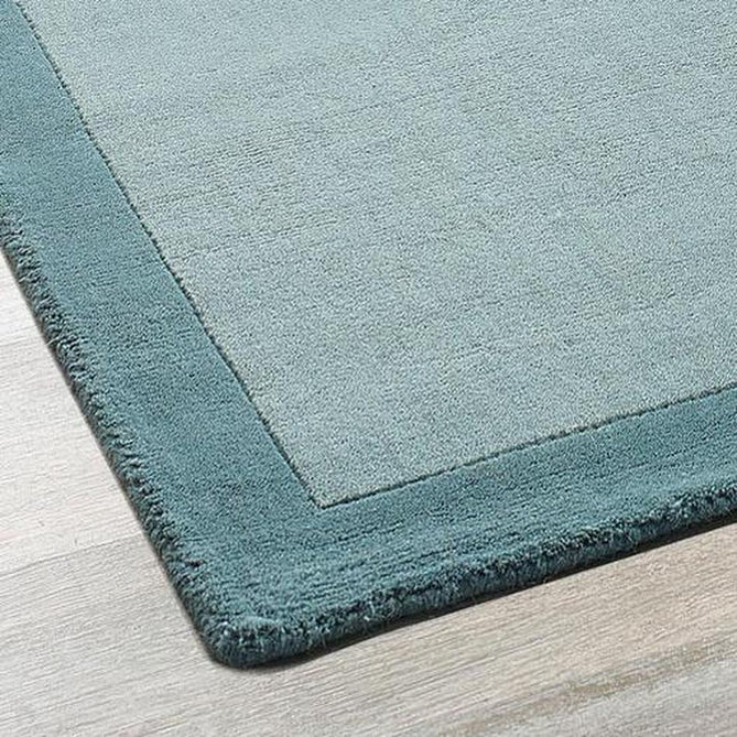 Borders Modern Plain Contrast Border Hand-Woven Wool Duck Egg Blue/Teal Blue Rug