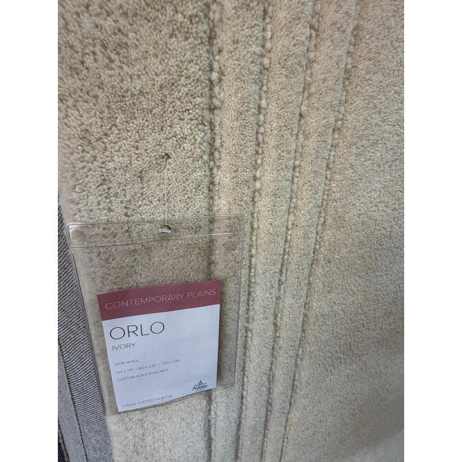 Orlo Modern Plain Tonal Variation Hand-Carved Hi-Lo Loop Pile Border Natural Undyed Wool Natural Ivory Rug