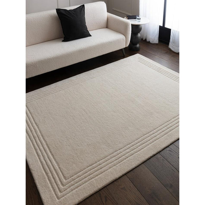 Orlo Modern Plain Tonal Variation Hand-Carved Hi-Lo Loop Pile Border Natural Undyed Wool Natural Ivory Rug