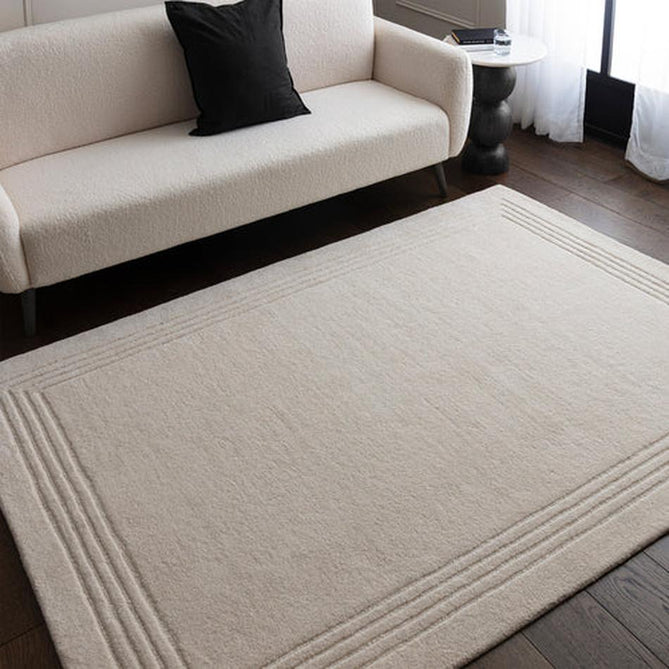 Orlo Modern Plain Tonal Variation Hand-Carved Hi-Lo Loop Pile Border Natural Undyed Wool Natural Ivory Rug