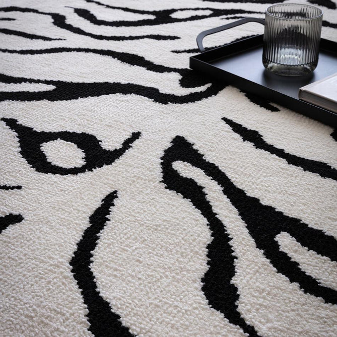 Wilder Tiger Modern Animal-Inspired Textured Soft-Touch Knitted Polyester Shimmer Durable Easy-Care Low Profile Short Pile Mono/White/Black Rug